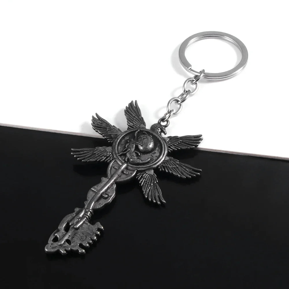 Six-Winged Unborn Metal Keychain - Game Village Inspired Alloy Pendant Keyring & Collectible Gift