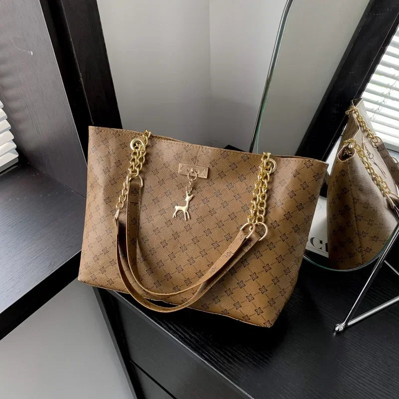 Women’s Large Capacity PU Leather Handbag — Fashion Tote Bag with Textured Design and Hanging Accessories