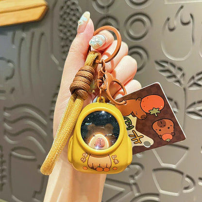 IFYOUOO Luminous Capybara Keychain — Cute Cartoon Space Capsule Keyring for Bags & Gifts